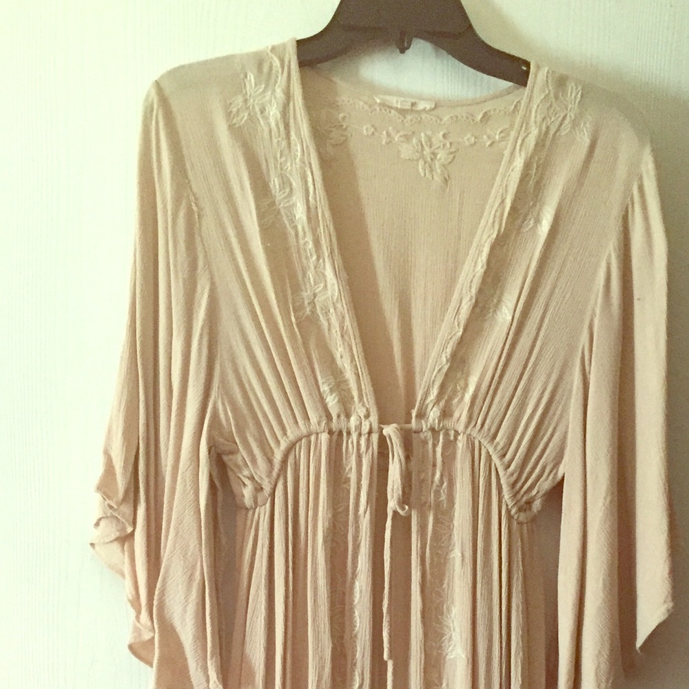 Super cute cream colored v cut tied open maxi top